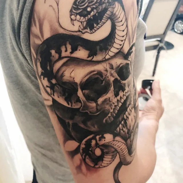 Black and grey skull and snake sleeve tattoo — WA Tattoo, Las Vegas