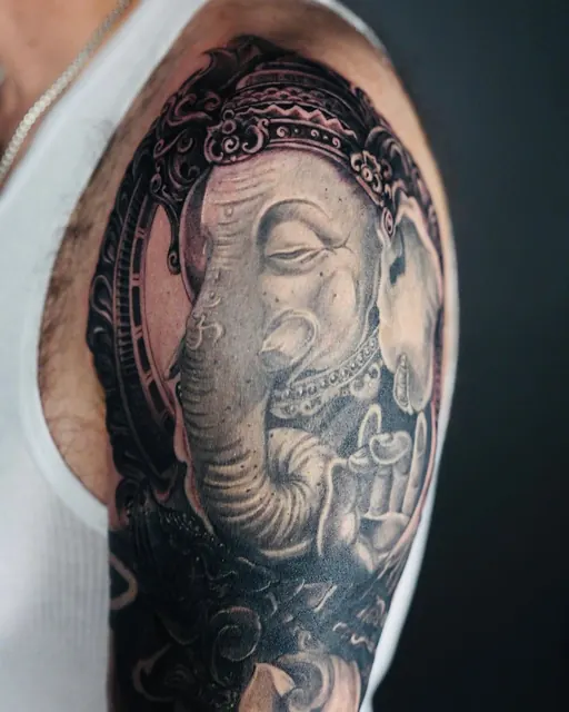 Black and grey Ganesha realism sleeve tattoo — WA Tattoo, Las Vegas