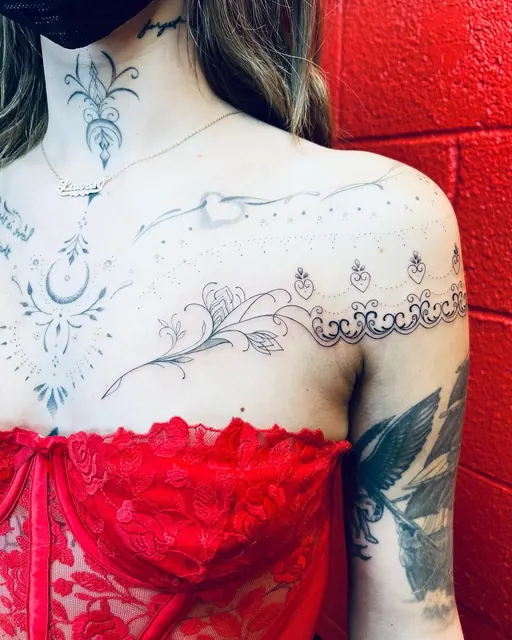 Fine-line ornamental chest and sternum tattoo — WA Tattoo, Las Vegas