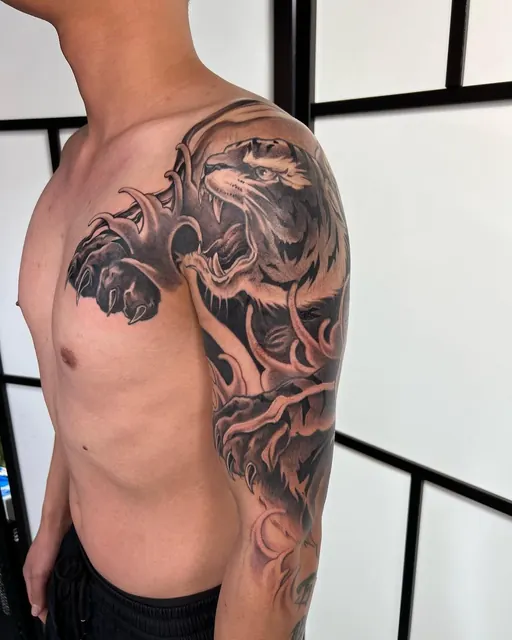 Black and grey Japanese dragon chest and sleeve tattoo — WA Tattoo, Las Vegas